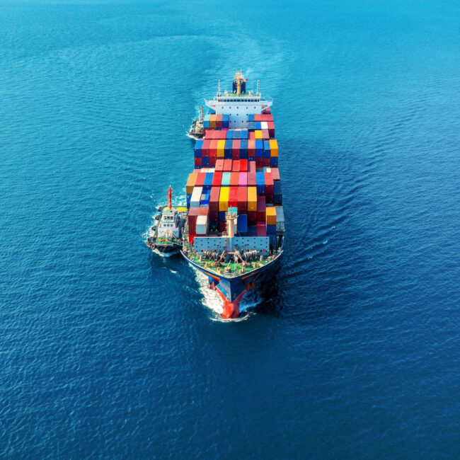 aerial-view-cargo-ship-with-cargo-container-sea-650x650